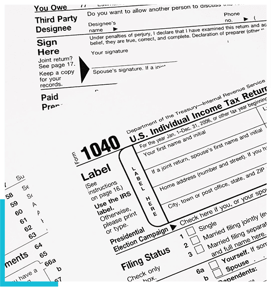 A close up of several different tax forms.